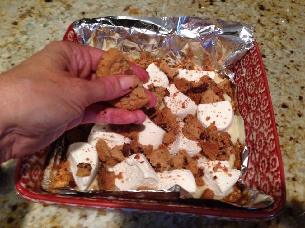 Dump on 1 cup crumbled cookies. This is the greatest idea for a top crust for a s'more.
