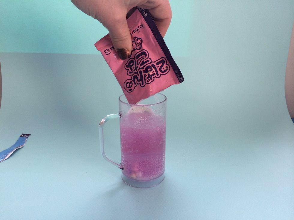 Dump PINK Pack #2 into Cup-This Changes color to purple and makes fizz and foam!! I love foam!!!!