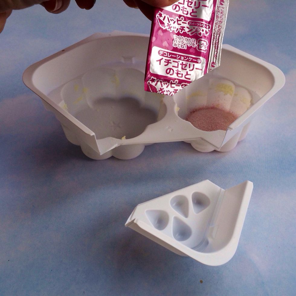 Dump PINK Packet (Berries) into tray that cake was removed from-----Get Berry Mold Ready