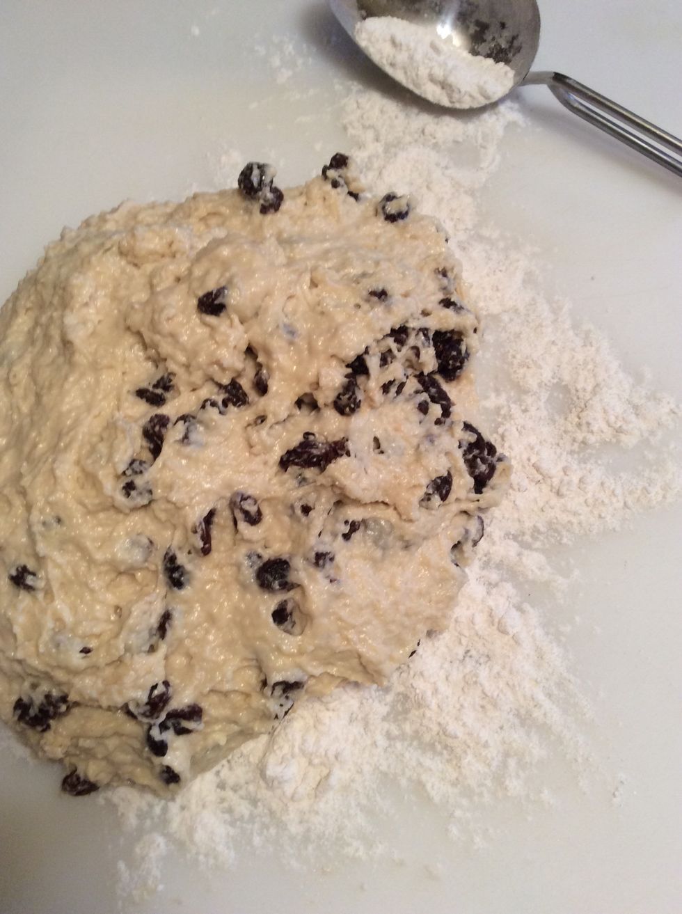 Dump soda bread out on to a well floured work surface. Work lightly and kneed slightly just enough to shape into a soft, ball shape.