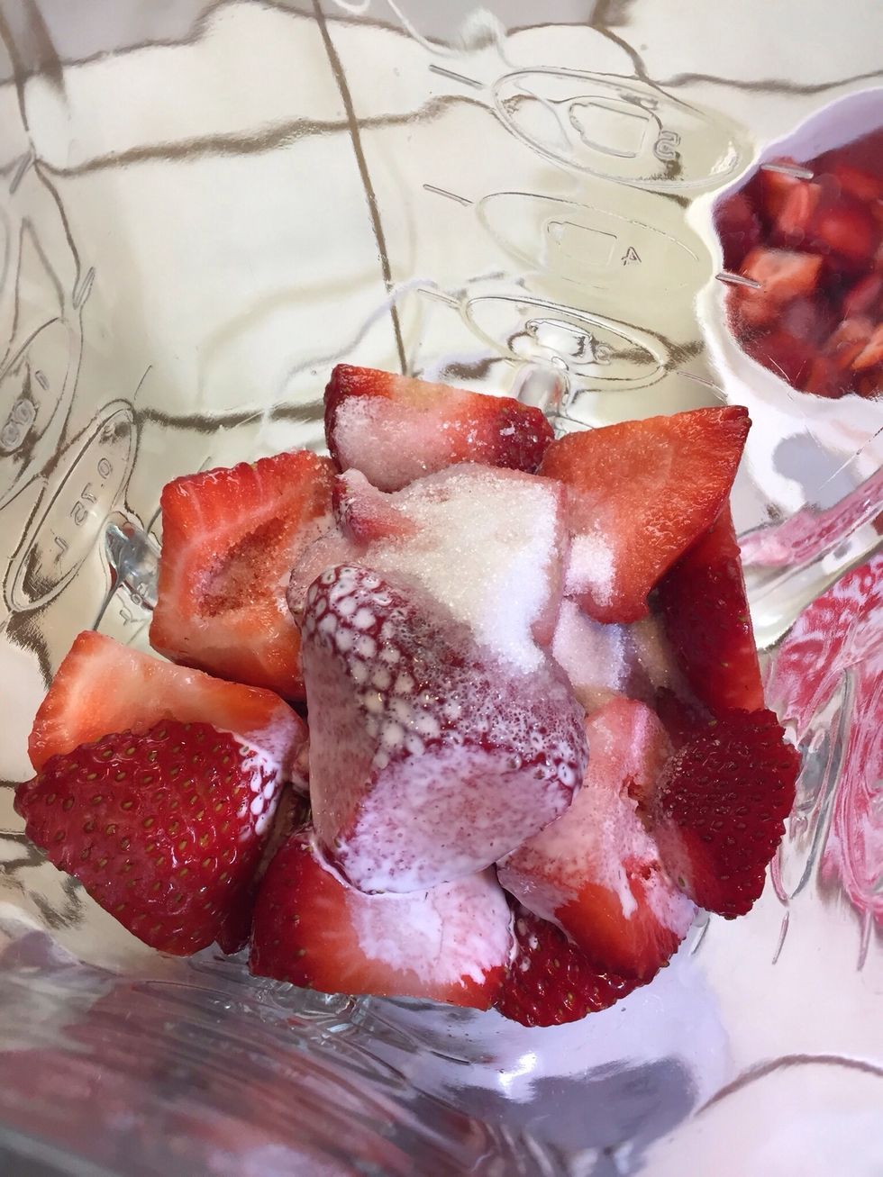 Dump strawberries in blender, add cream and sugar, a tablespoon at a time.