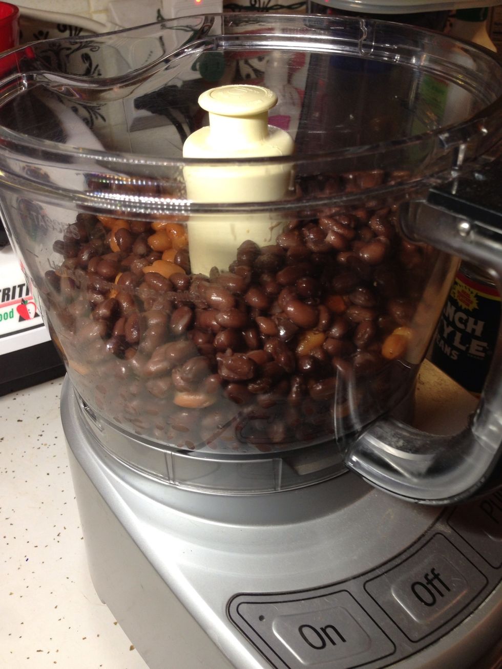Dump the drained beans into a food processor