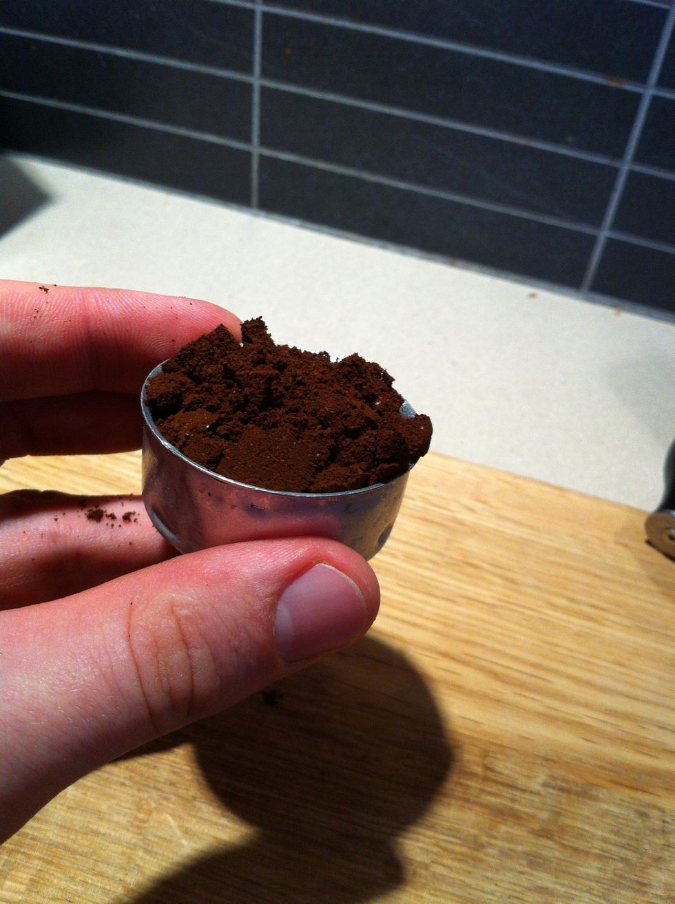 Dump the ground coffee into the filter basket.