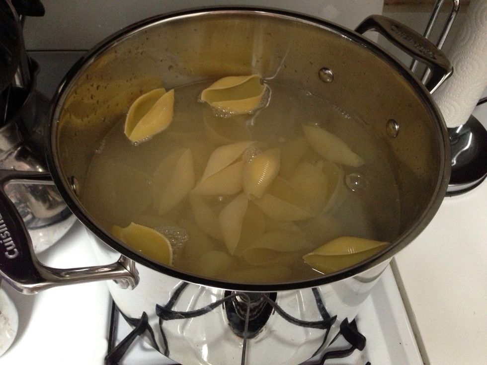Dump the pasta shells in the boiling water so it can cook while you make the sauce.