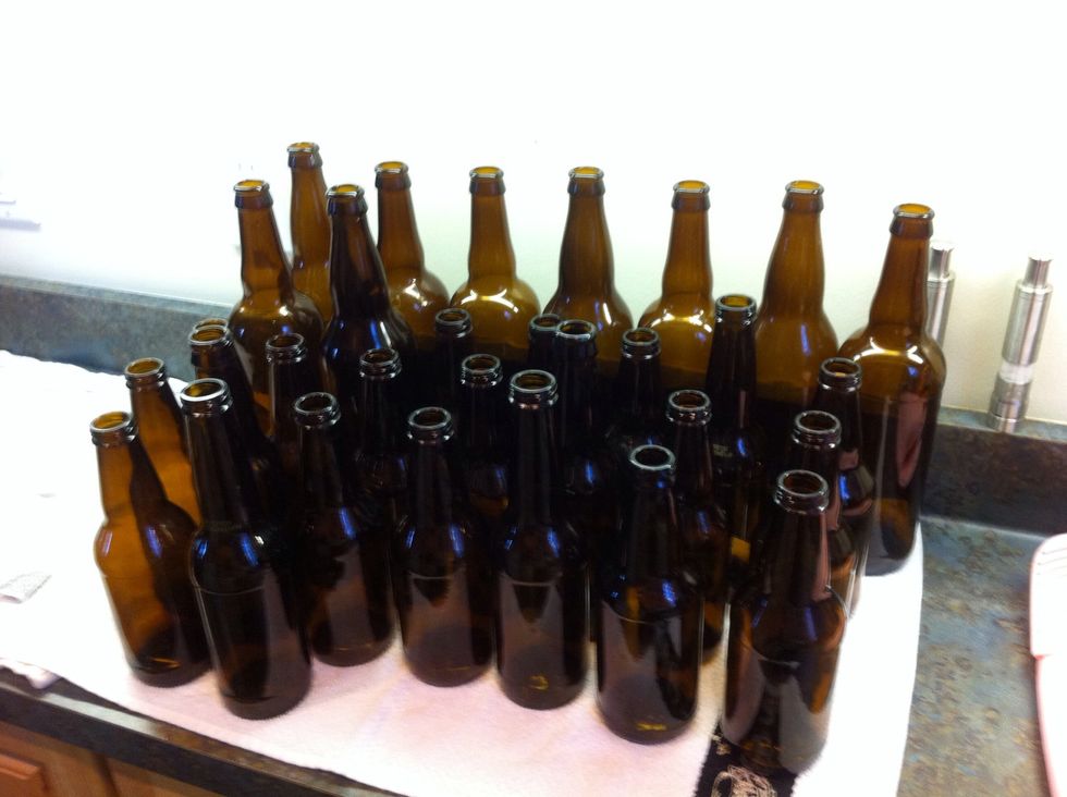 dunk each bottle in the sanitizing wash for a minute or two. if you are just using the wash to sanitize I would dunk longer. but we are going to cook these glass beasts after this for ultimate cleanse