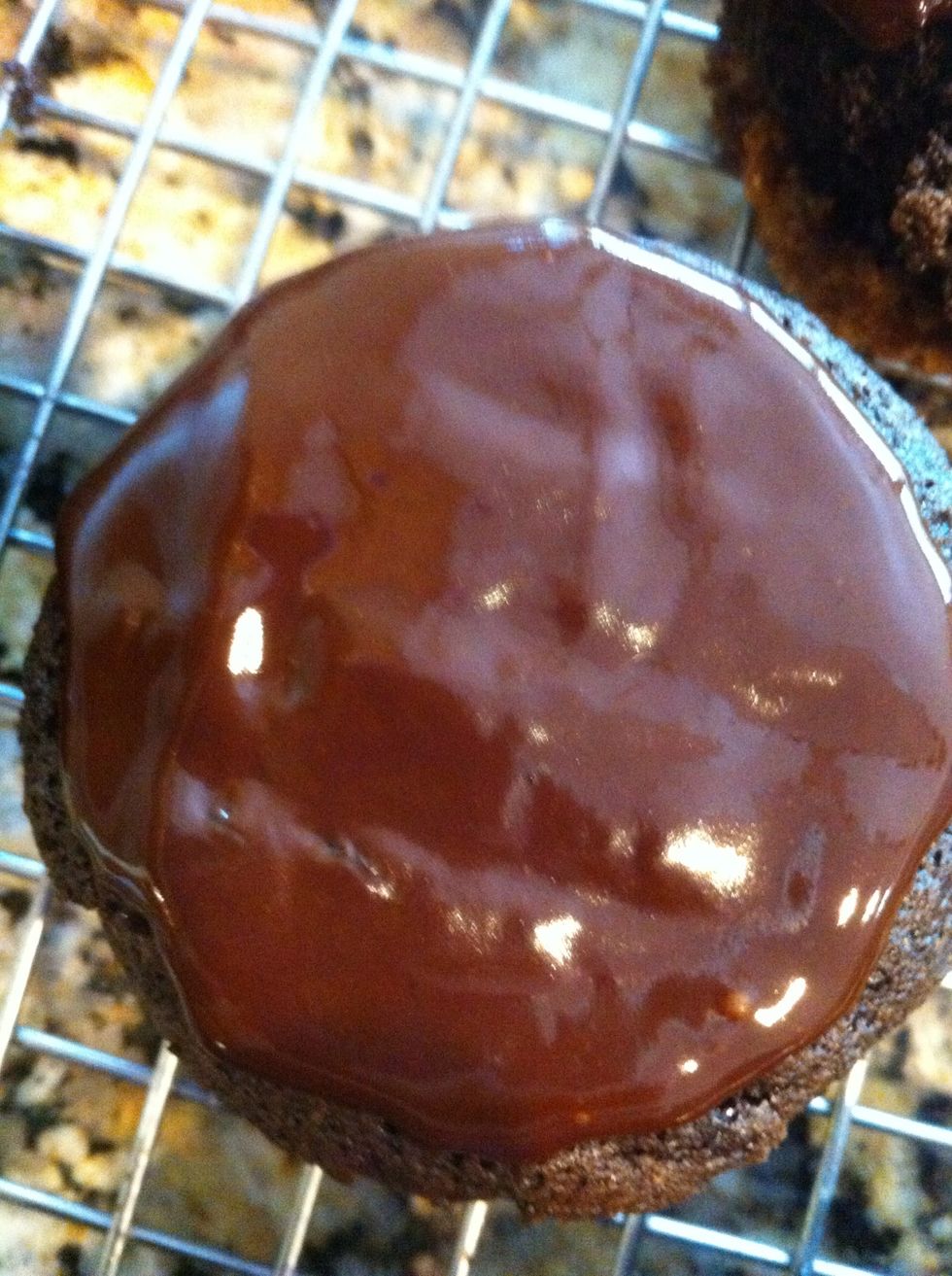 Dunk the tops of cupcakes into the glaze. Let Them set up about an hour (the choc will harden) before you add the marshmallow fluff topping.