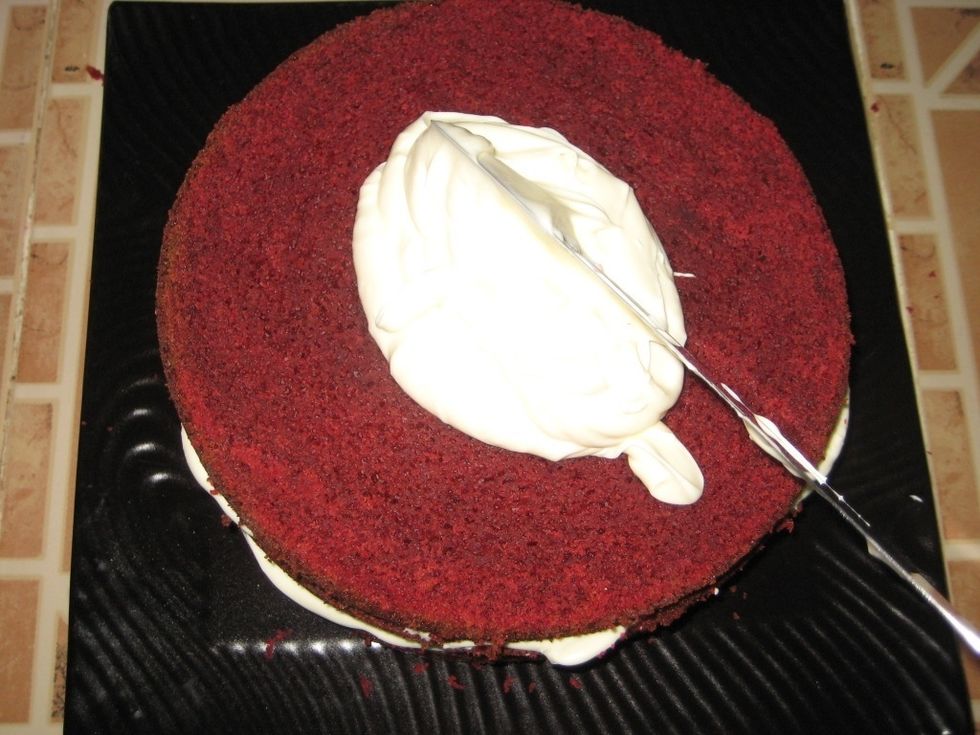 During frosting, slice the cake into 2 or 3 layers and spread the cream cheese between the layers.