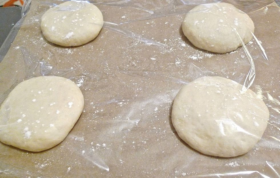Dust buns very lightly with flour. Then gently place a piece of cling wrap over the baking sheet. Do not seal the end of wrap. Let buns rise until double in size, about 1 hour.