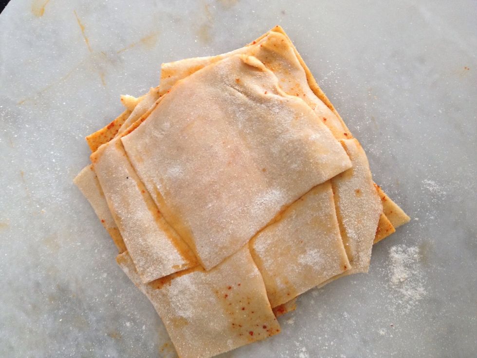 Dust otherside too and carefully with light hands roll it