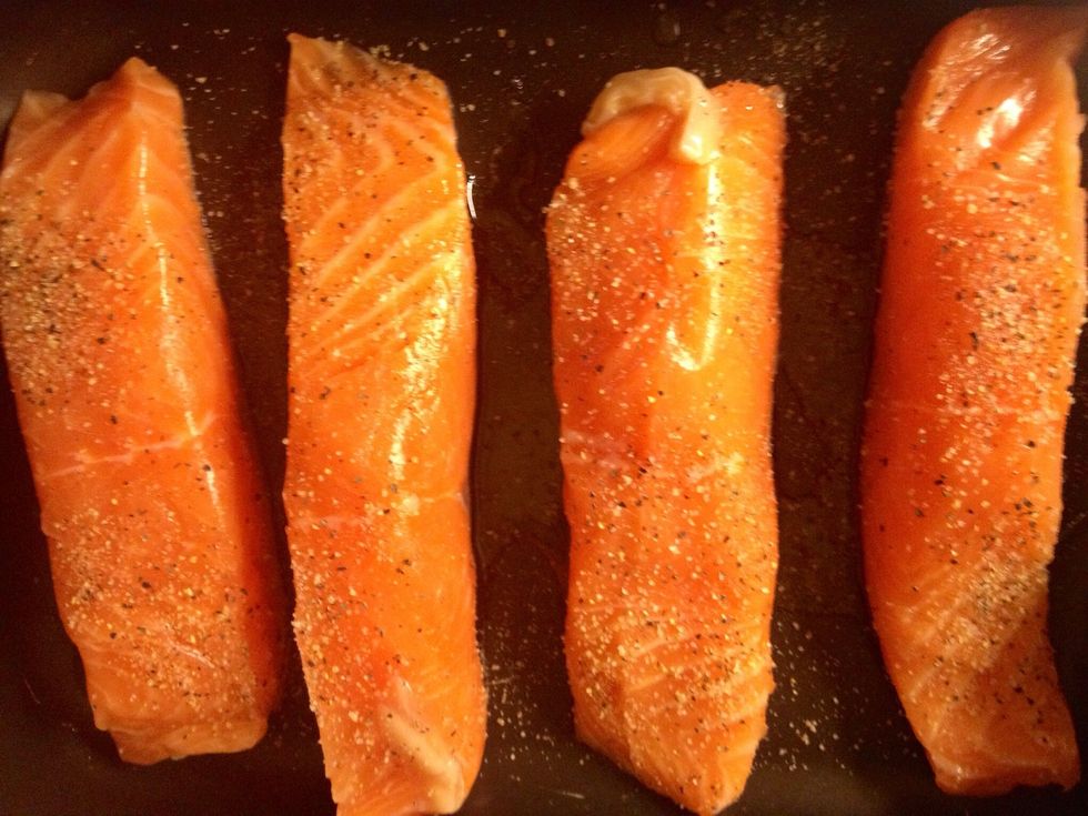 Dust some salt and lemon pepper on top of the salmon fillets. Cook the fillets for 15 minutes.