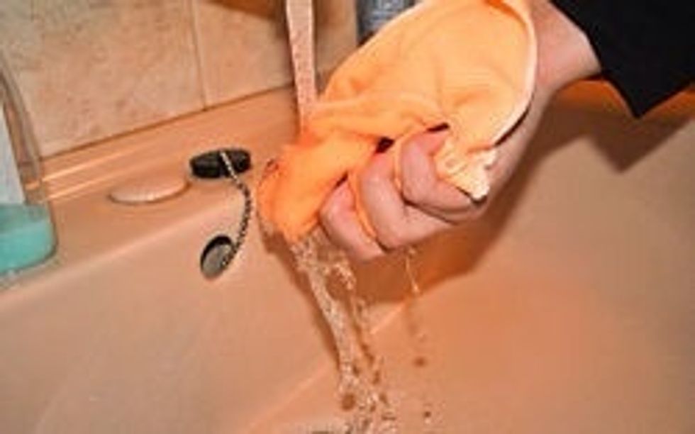 Dust the furniture, starting with anything that is dark wood, as dust shows more clearly on dark surfaces. Don\u2019t use a dry rag; instead, buy wood cleaners or simply use a wet rag in warm water.