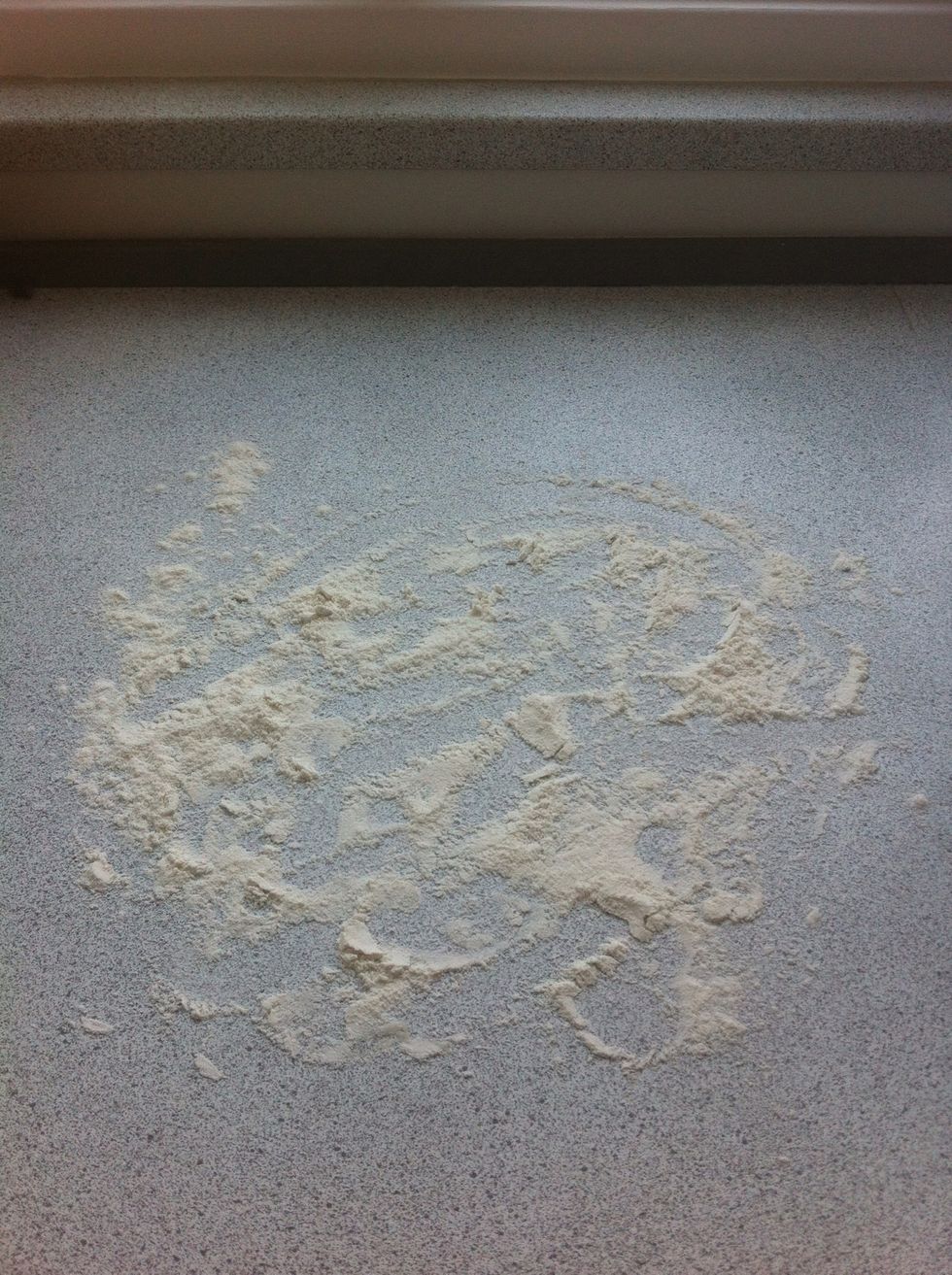 Dust the table with flour.