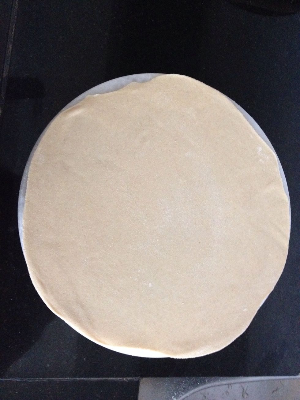 Dusting dry wheat floor as you roll as big as possible