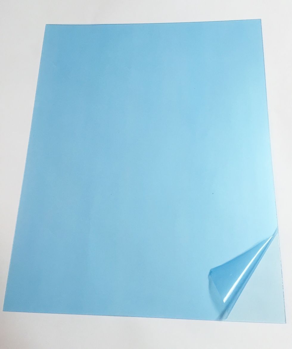 each Monoprint Plate comes with a protective blue liner on both front and back. i removed only the front liner so that the plate would show up better in photos.