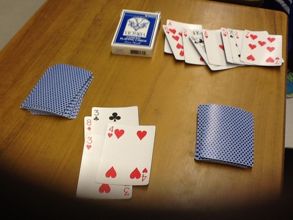 Each player takes one card out of their pile whoever s card has a greater value takes both cards