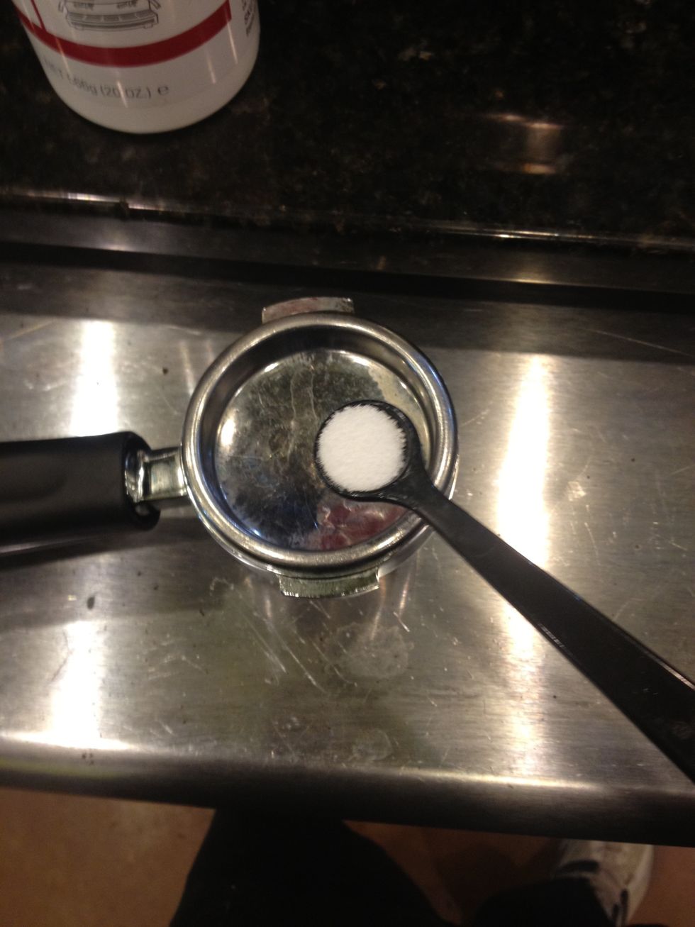 Each portofilter should have one level scoop of Cafiza