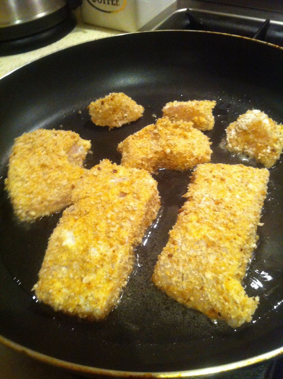 Each side of the fish should be entirely coated with breadcrumbs. Place the oil in a frying pan and cook the fish on low-medium until golden, usually around 15 minutes