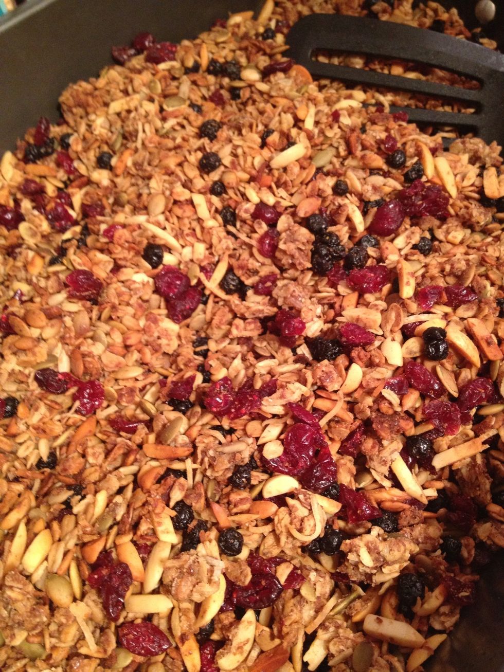Each time you stir it, turn down the heat a little. This stuff can burn easily. When the almonds are golden brown (about an hour) take it out of the oven and cool completely before adding dried fruit.