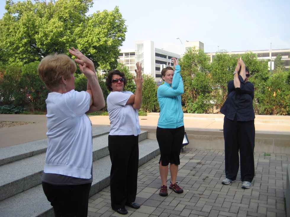 Eagle arms-wrap your arms and hands pressing palms together