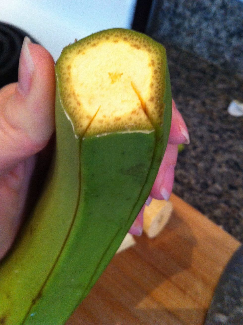 Easiest way to peel the plantain that I've found; run knife down the grooves of plantain then lift up the peel with the sides of your thumb, pulling the peel away