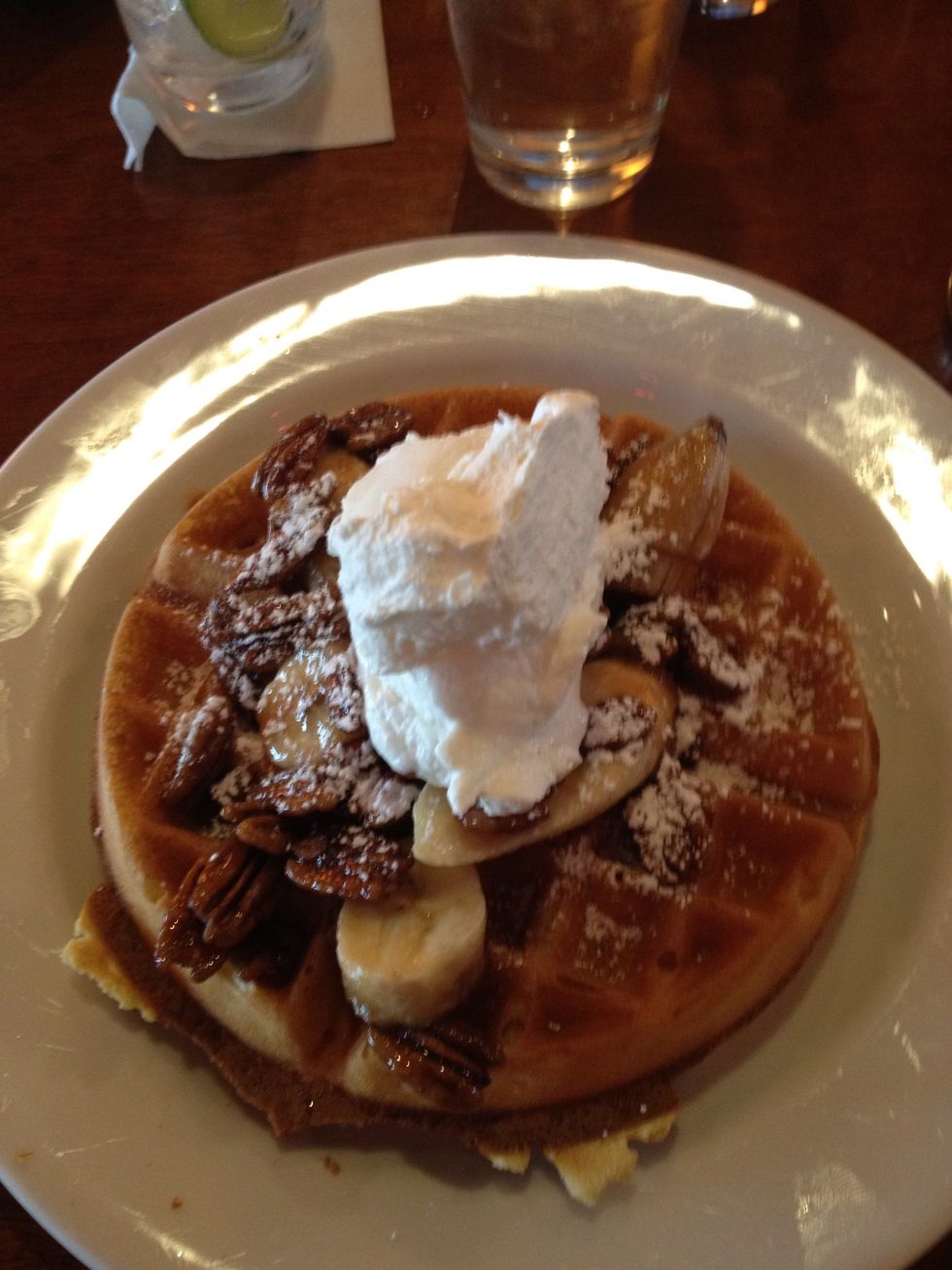 Eat a large, decadent breakfast (sweet or savory). In this case it is a banana's fosters waffle.