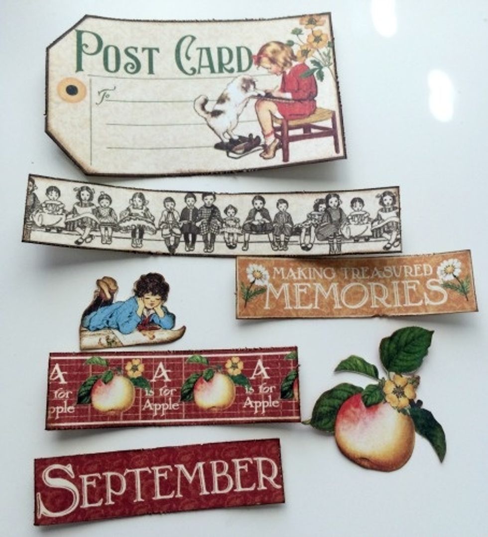 Edge distress all the cut apart pieces except the fussy cut images. With a blending tool, apply Vintage Photo ink to the cut aparts and fussy cut images.