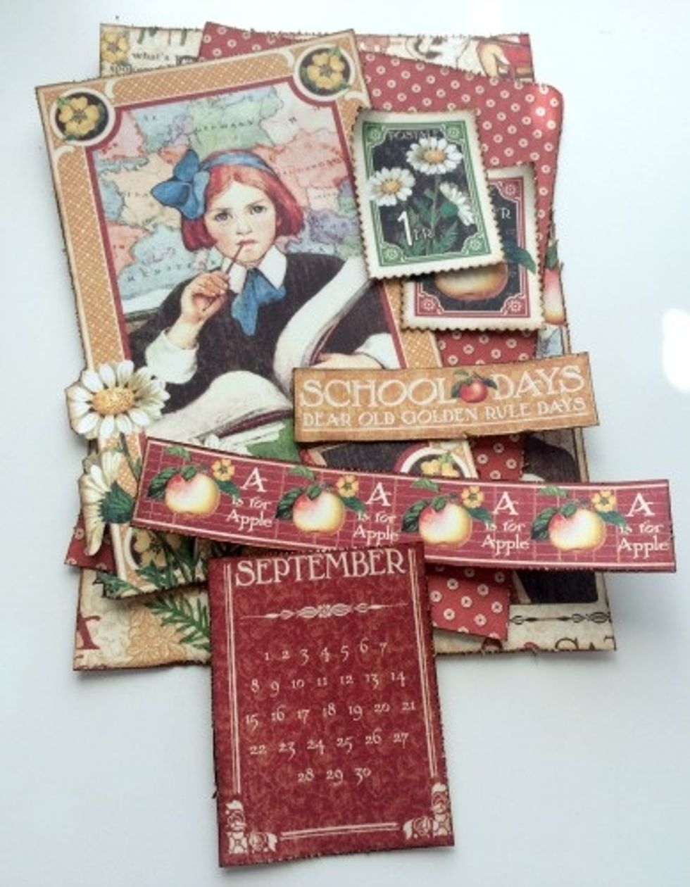 Edge distress all the patterned paper pieces, cut aparts and brown cardstock. With a blending tool, apply Vintage Photo Distress ink to the edges of the pattern paper and cut aparts.