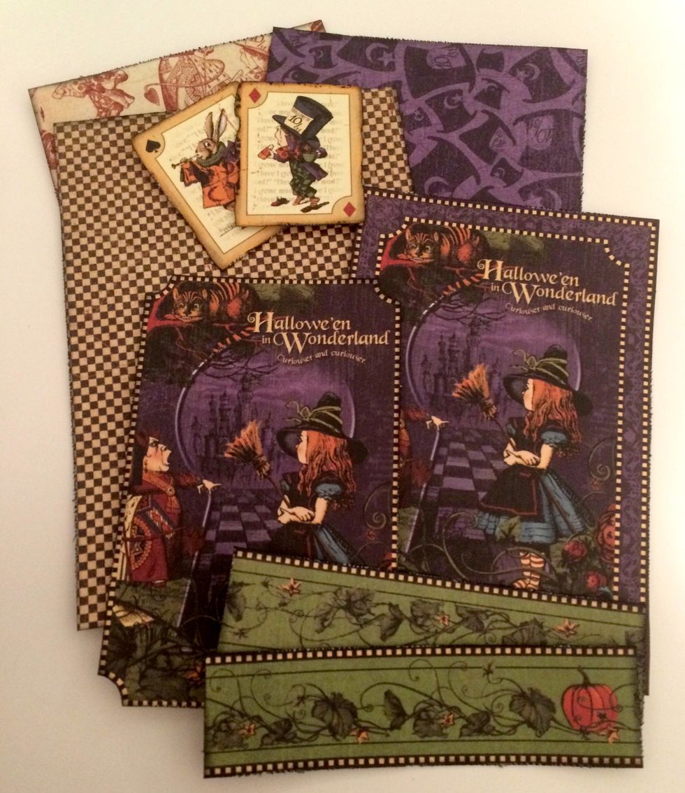 Edge distress and ink all the edges of the patterned paper, borders and cut aparts using a blending tool and Black Soot Distress Ink.