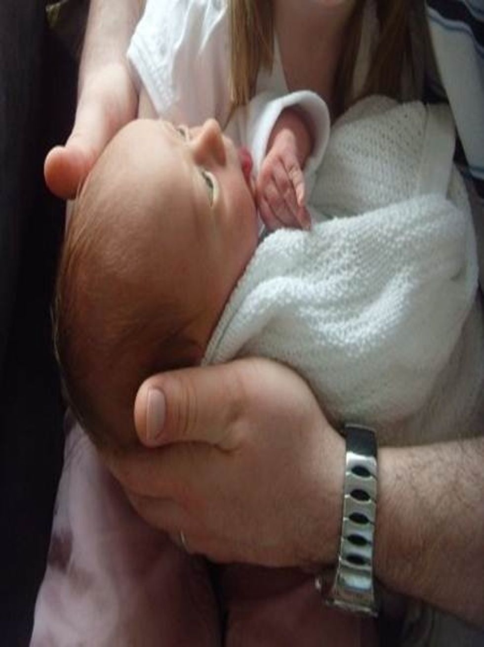 Edward is sticking his tongue out copying his daddy - he is communicating. We need to respond sensitively to children's communication and immerse them in a world of talk and positive body language.