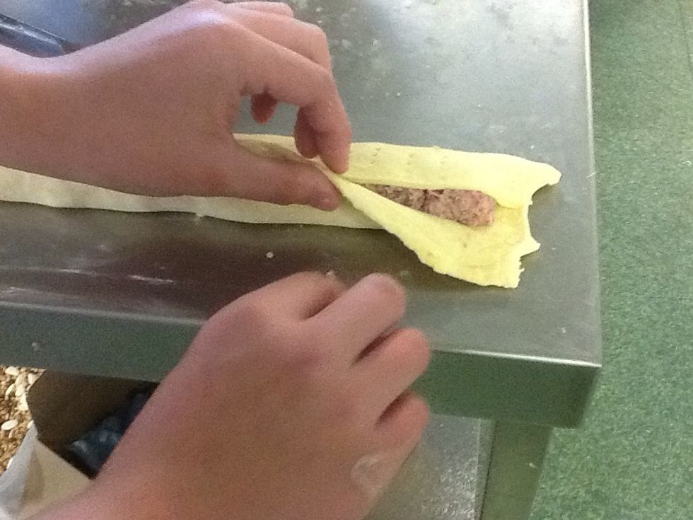 Egg wash one side of the pastry and fold up and seal