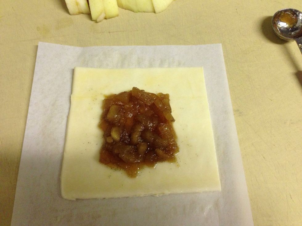 Egg wash puff pastry then put 2 tsp of apple compote in the center.