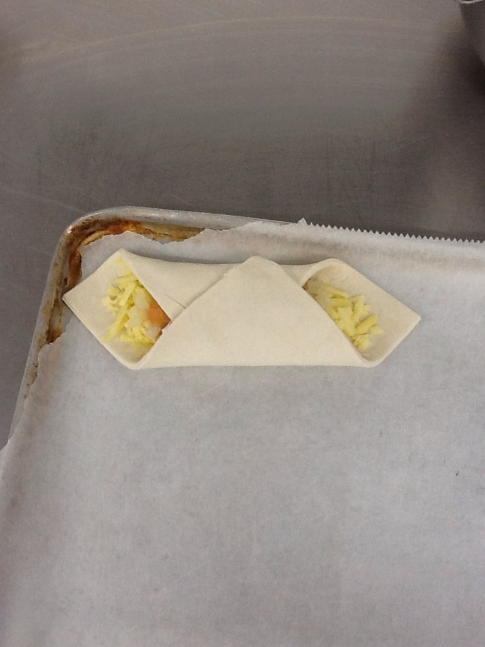 Egg wash the edges of the pastry, fold corner flaps to centre so they overlap and the egg wash sticks them together.