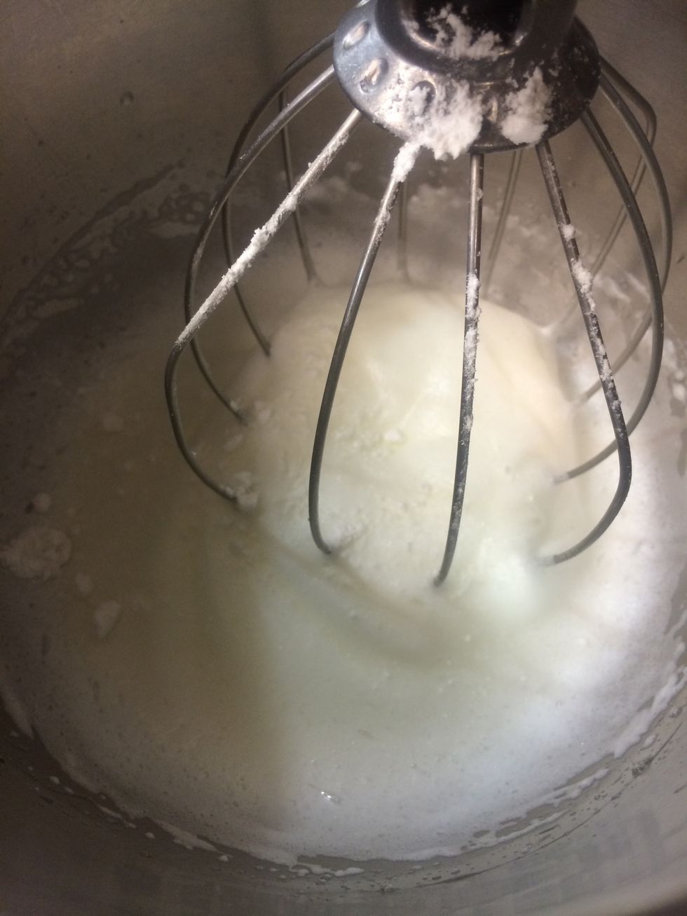 Egg whites and cream of tartar are whipped into soft peaks.