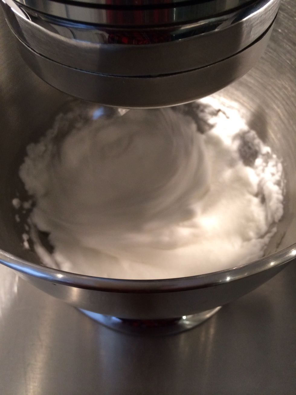 Egg whites at room temperature. Beat them at a medium speed to soft peaks...add the 50 gm of sugar and continue to beat until you get stiff peaks