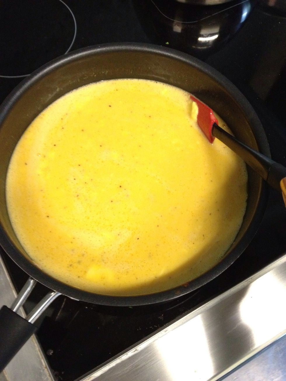 Eggs will need about 1 minute of sitting. Then continually stir & fold. Work at this from the edges in. Folding will help with the fluffiness of the eggs.