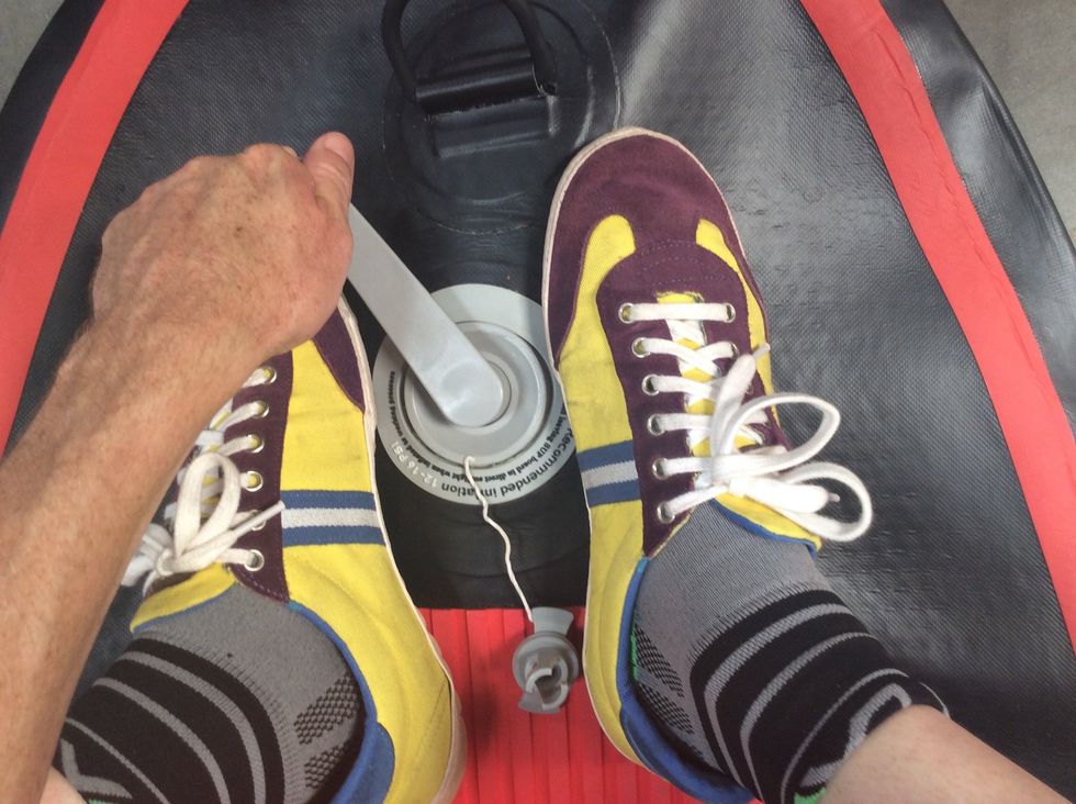 Eighth, make quarter turns clockwise with the wrench (between your shoes) until you can no longer tighten.  The point of standing is to apply pressure downward so the female valve part doesn't spin.