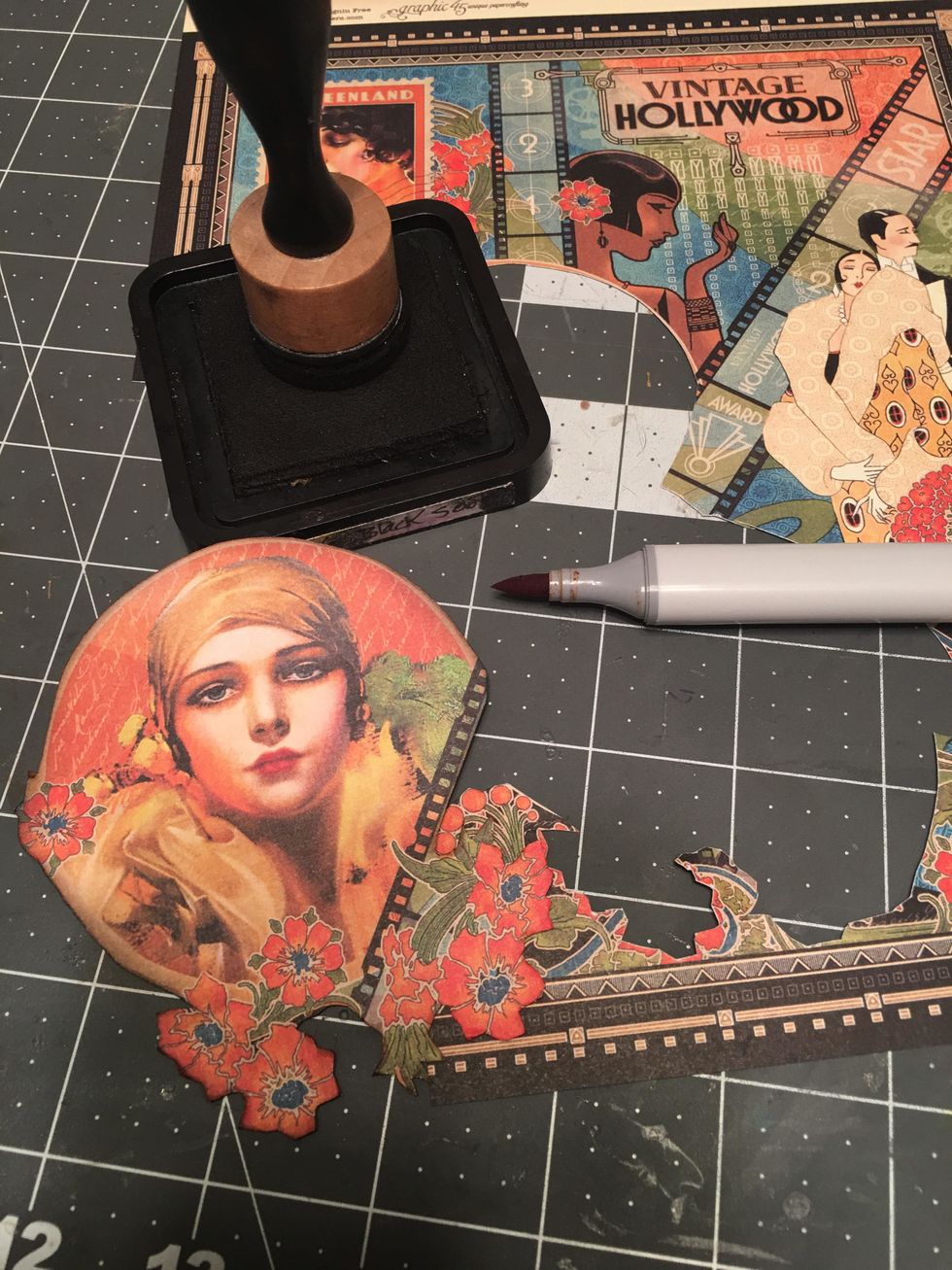 Either ink the edges of the pieces you fussy cut out or use a dark gray or black alcohol marker to color the cut edges.