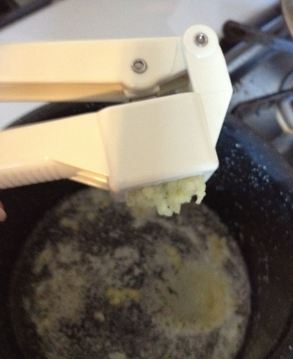 Either use a garlic press or mince the garlic into teeny, tiny pieces. Add the garlic to the melted butter.