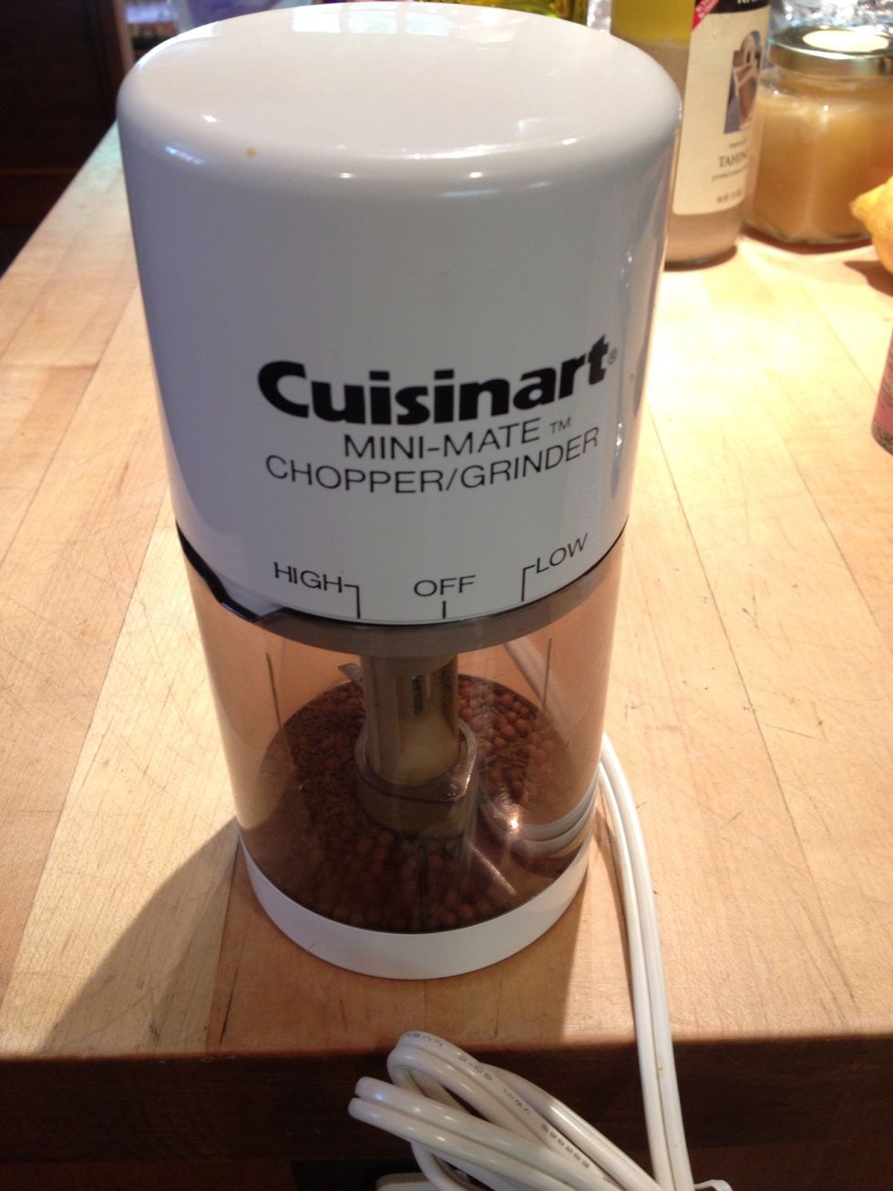 Either use a mortar and pestle to grind the roasted seeds to a fine powder or alternatively, an electric spice grinder.