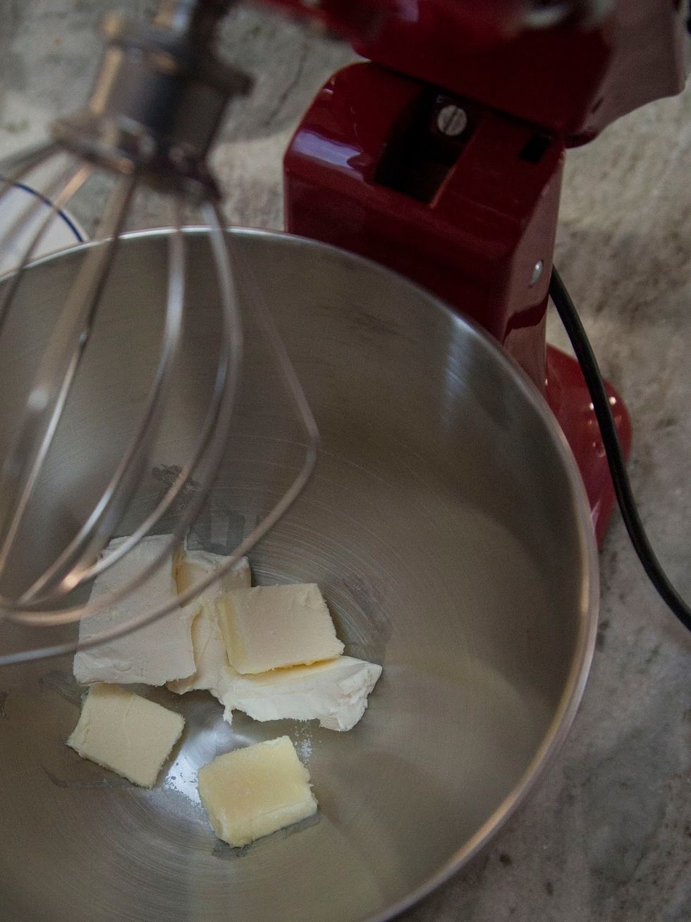 Either using a stand mixer or a hand mixer cream together the cream cheese, butter and salt. After every step, scrape the sides of the bowl to make sure everything is mixed together.
