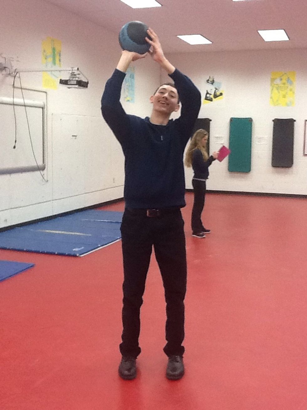 Elbow flexion; knee extension;  right wrist extension, left wrist neutral; biceps, triceps, deltoids are used feet are in neutral position.