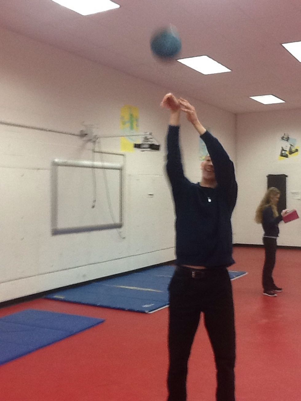 Elbow flexion; knee extension; right wrist extension, left wrist neutral ; biceps, triceps, deltoids are used feet are in neutral position.