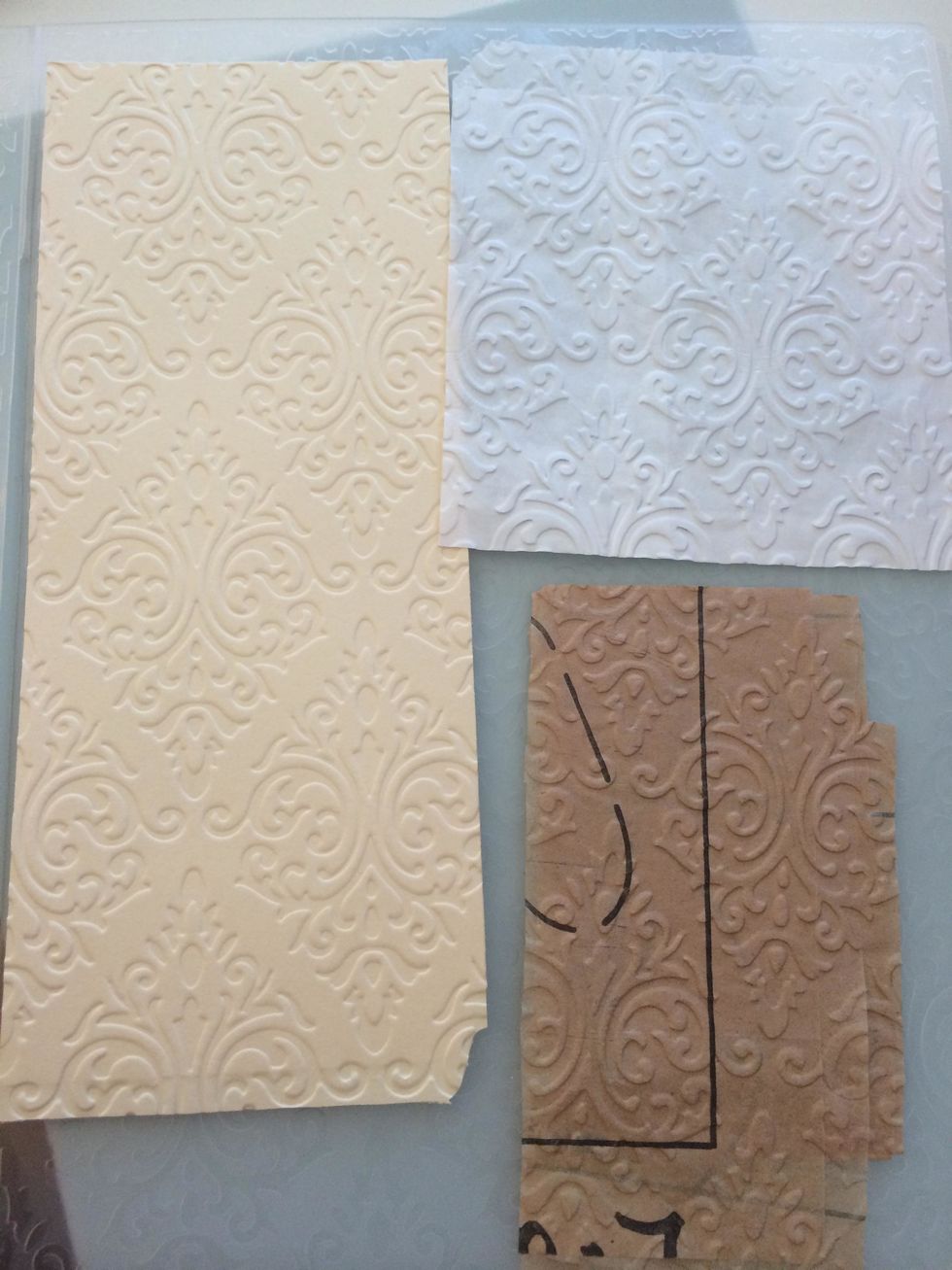 emboss french fry bag, sewing pattern pieces, and cut file folder pieces