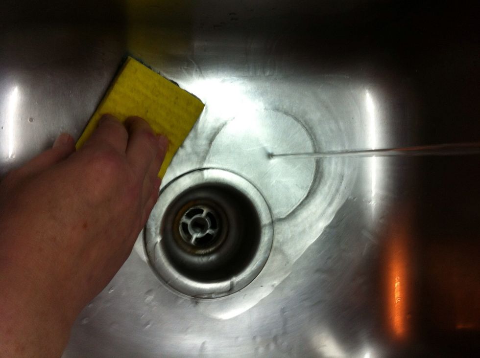 Empty all dishes from sink, yes, the ones that didn't fit in the dishwasher. Place on counter ready to go. Clean the sink.