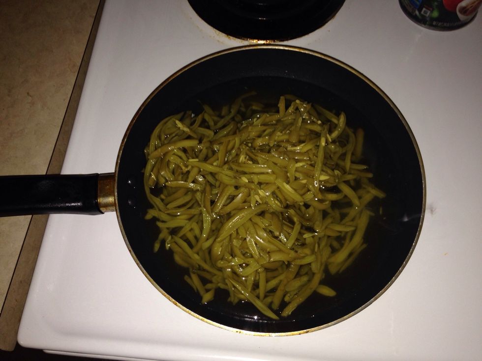 Empty both cans into pan.