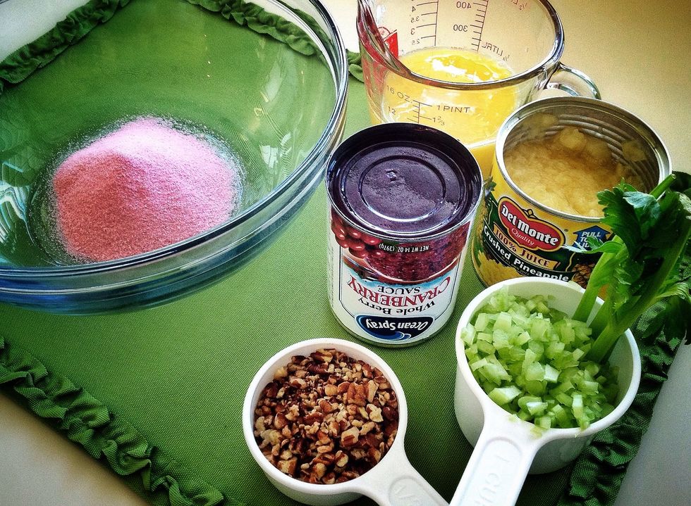 Empty JELL-O into bowl. Combine orange juice and pineapple juice. Liquid will be a cup.