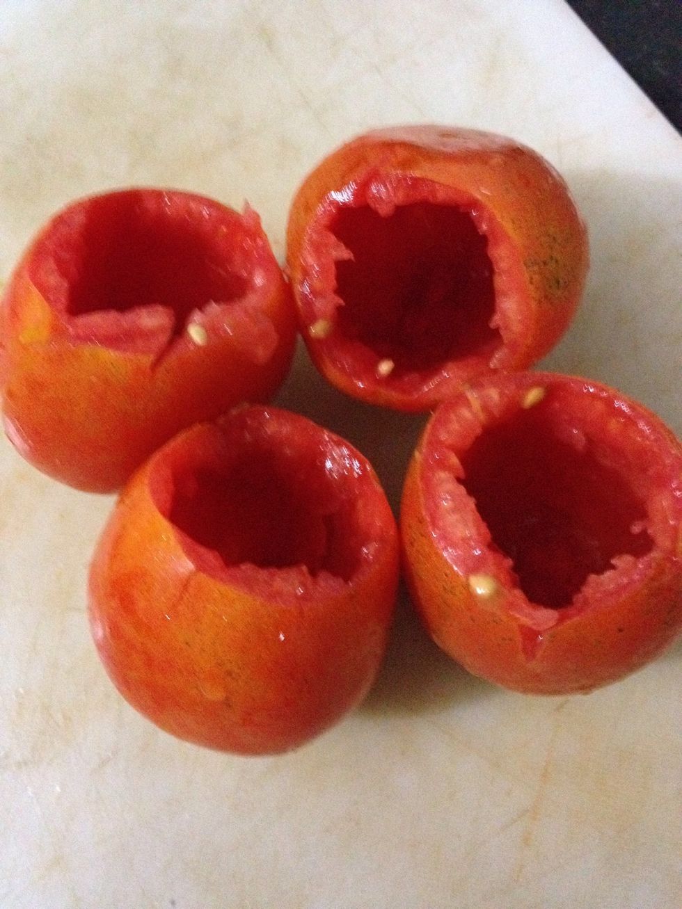 Empty out the tomatoes as shown in pic