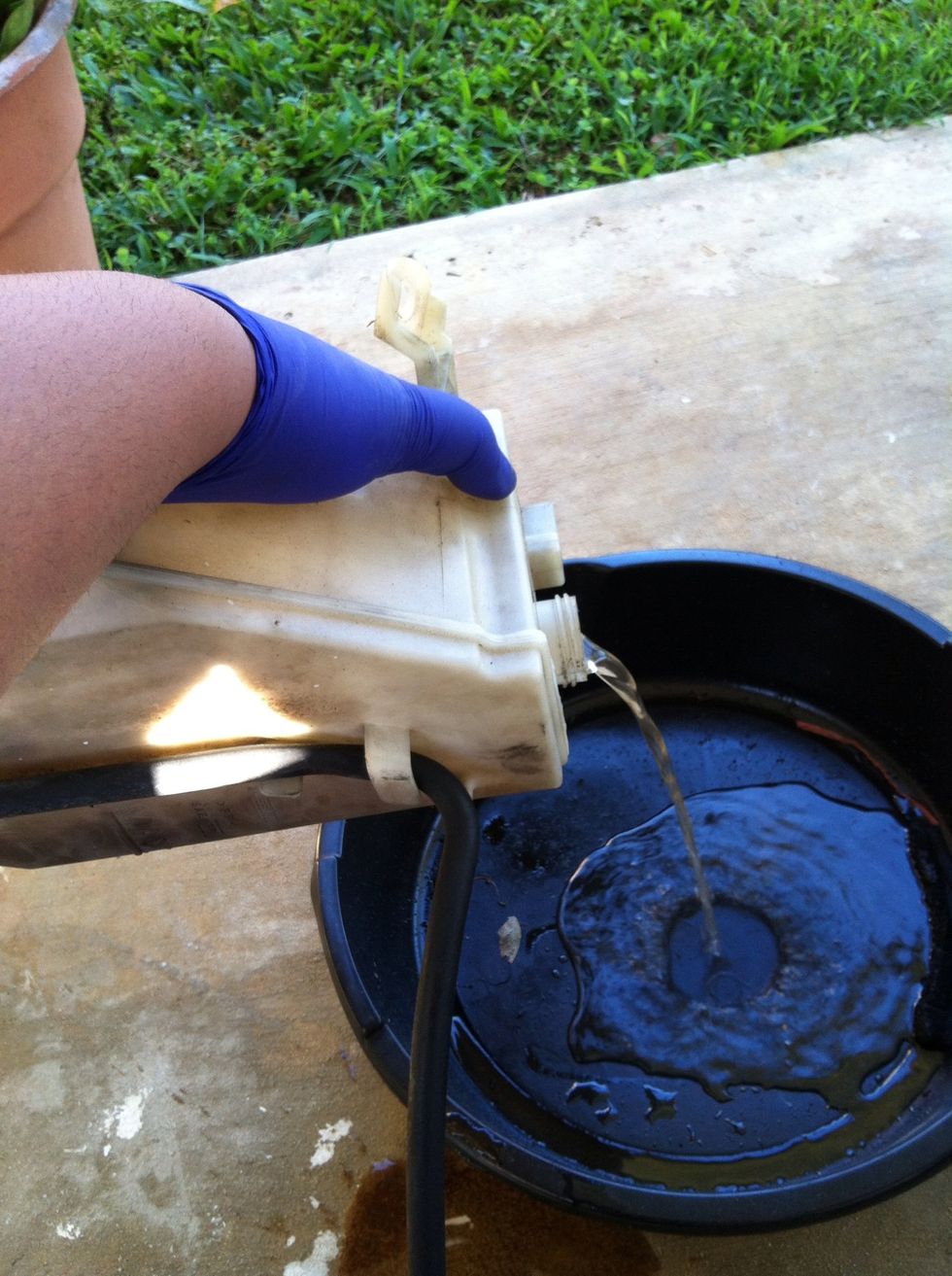 Empty the coolant container.