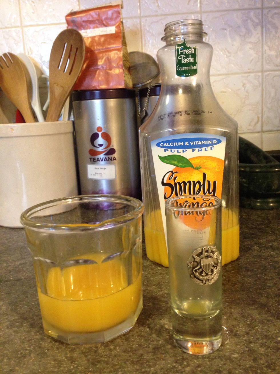 Empty the shot glass into the rocks glass.