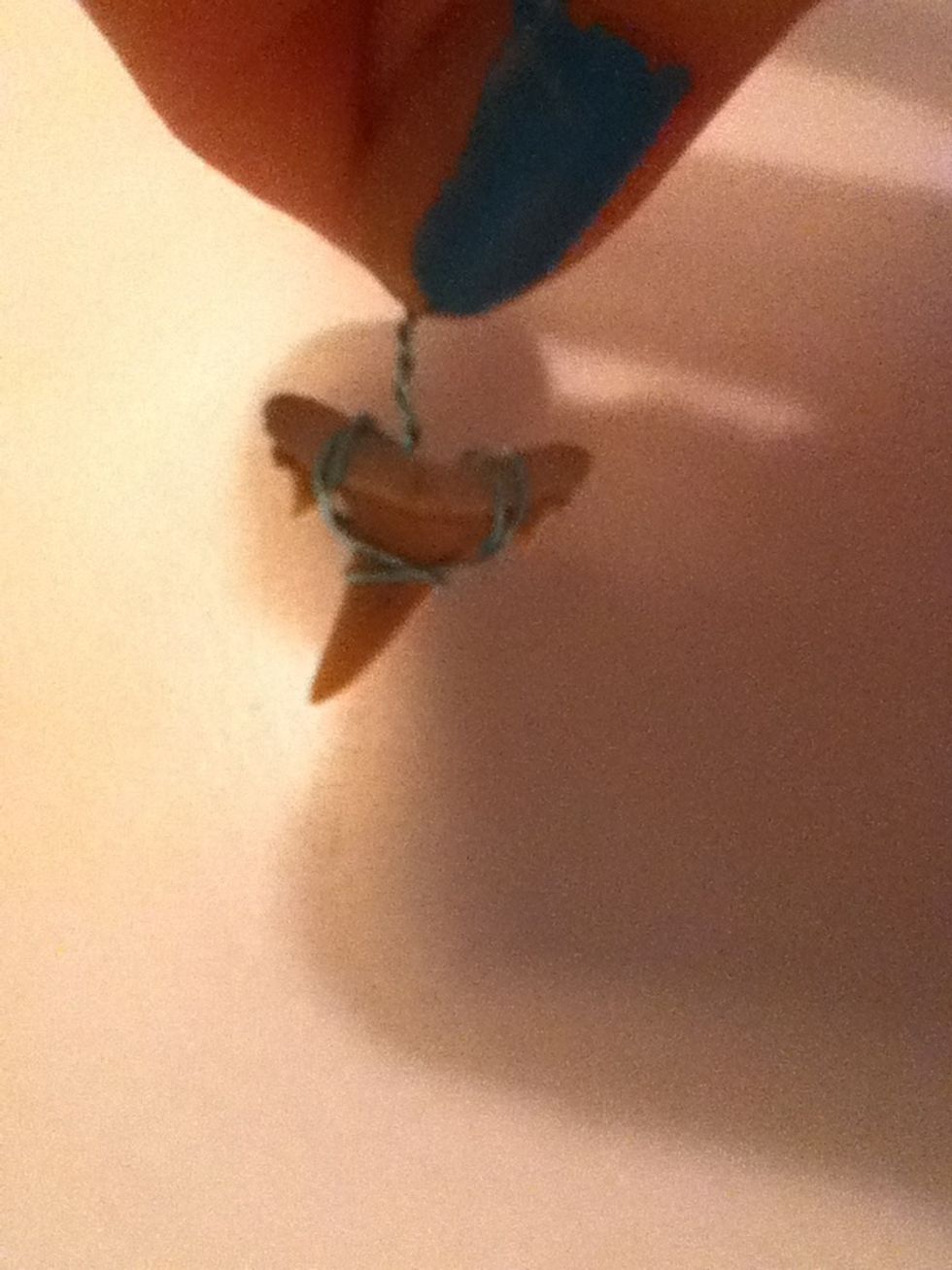 End up with the wire on the back side and twist the wire